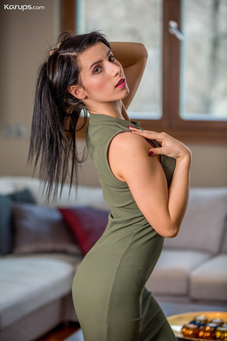 Slutty brunette Nelly Kent sheds short dress to expose her small boobies