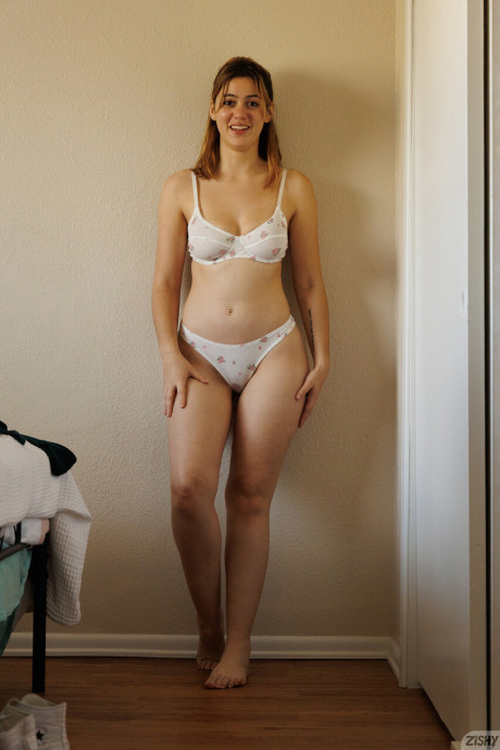 Adorable babe Ellie Nova shows her stunning titties and huge ass too