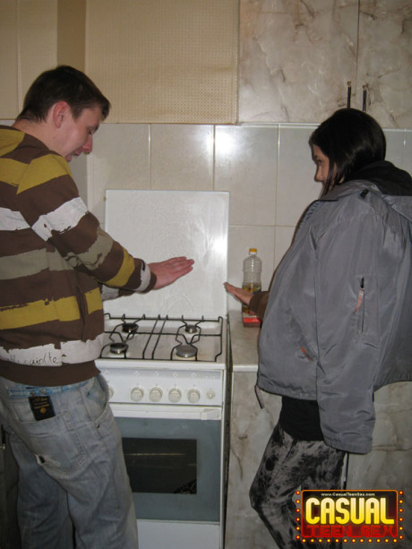 Teen lovers engage in a hard couples fuck in the cuisine