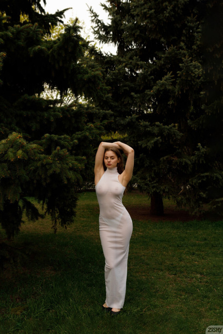 Stunning braless amateur babe with giant titties posing in her white dress outside