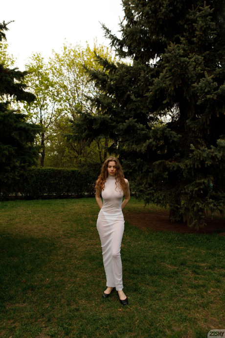 Stunning braless amateur babe with giant titties posing in her white dress outside