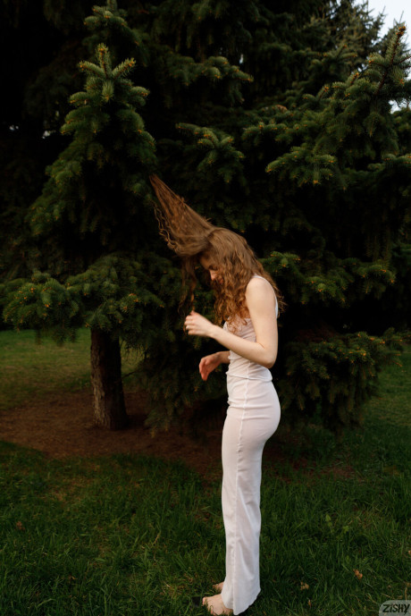 Stunning braless amateur babe with giant titties posing in her white dress outside