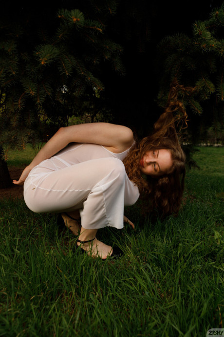 Stunning braless amateur babe with giant titties posing in her white dress outside