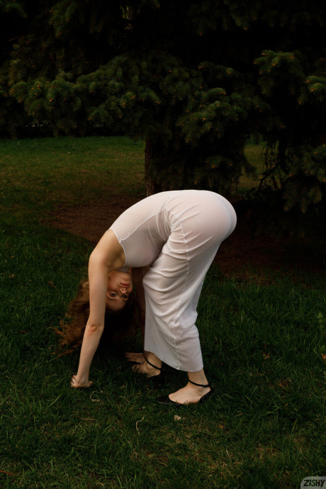 Stunning braless amateur babe with giant titties posing in her white dress outside