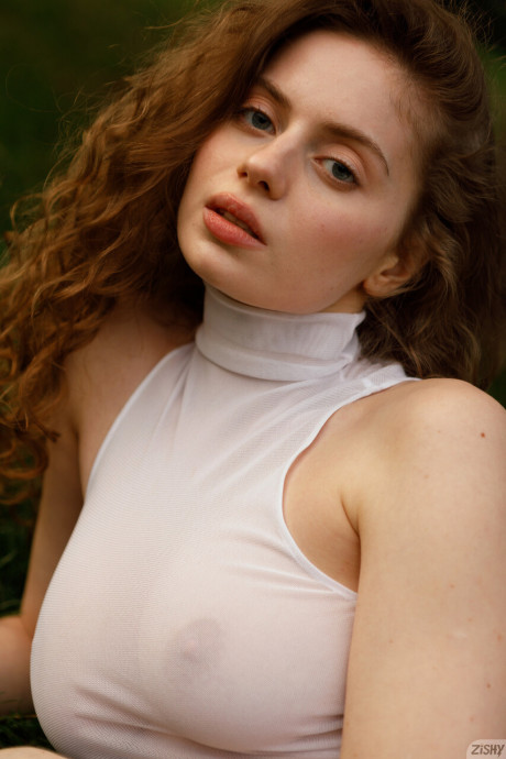 Stunning braless amateur babe with giant titties posing in her white dress outside