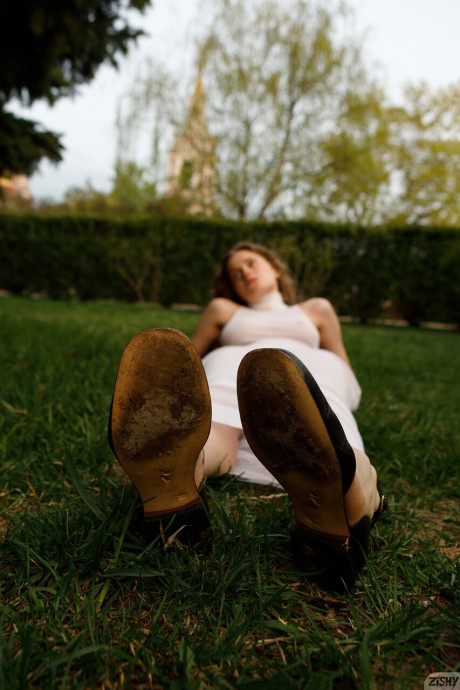 Stunning braless amateur babe with giant titties posing in her white dress outside