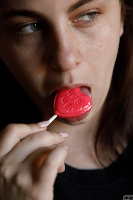 Amateur Milly Marks flaunts her incredible gigantic breasts while licking a lollipop