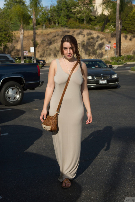 Young babe Lanie Morgan exposes her enormous juggs and shaved twat in public