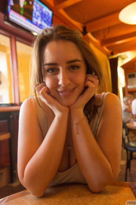 Young babe Lanie Morgan exposes her enormous juggs and shaved twat in public