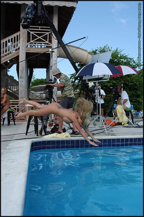 Lesbian bitches go for a skinny dip after a game of strip poker by a pool