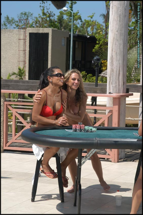 Lesbian bitches go for a skinny dip after a game of strip poker by a pool