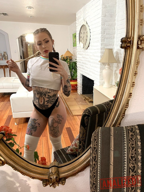 Tattooed vixen Baby Sid takes selfies of her incredible butt and bald twat