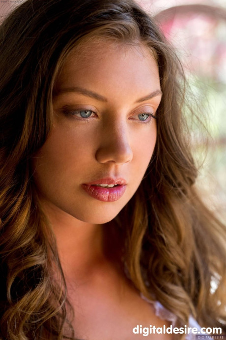 Glamorous babe Elena Koshka strips her shorts and spreads her trimmed twat