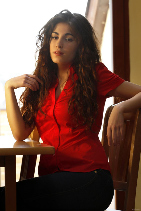 Brunette teenie Soika A slowly doffs her clothes and teases with her titties