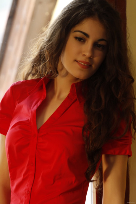 Brunette teenie Soika A slowly doffs her clothes and teases with her titties
