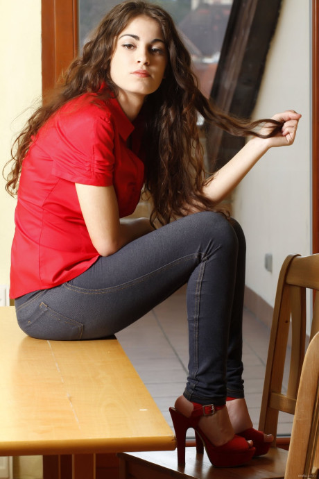 Brunette teenie Soika A slowly doffs her clothes and teases with her titties