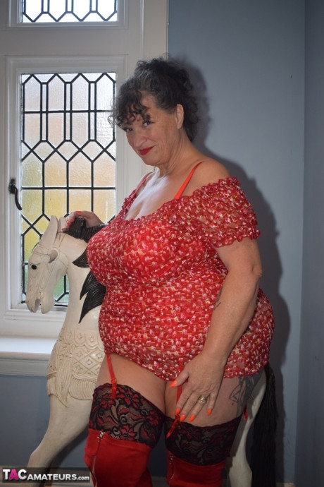 Wide grandmother shows her humongous titties and giant booty in over the knee boots