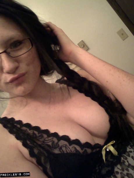 Geeky brunette Freckles 18 touches her hot boobs in her solo homemade session