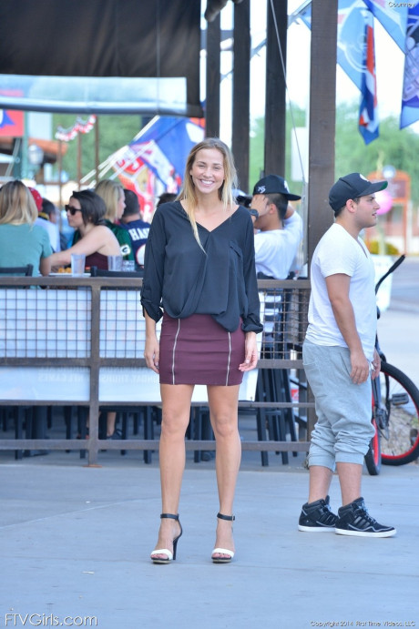Glamorous blondy in a miniskirt Courtney flaunting her nice tits in public