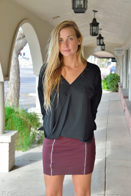 Glamorous blondy in a miniskirt Courtney flaunting her nice tits in public