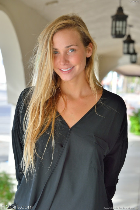 Glamorous blondy in a miniskirt Courtney flaunting her nice tits in public