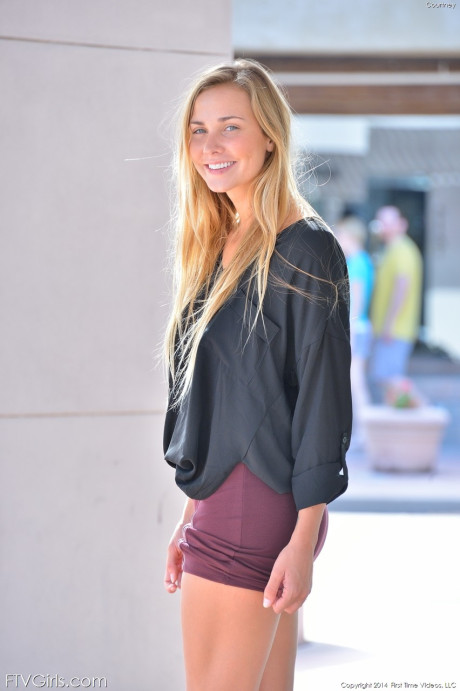Glamorous blondy in a miniskirt Courtney flaunting her nice tits in public