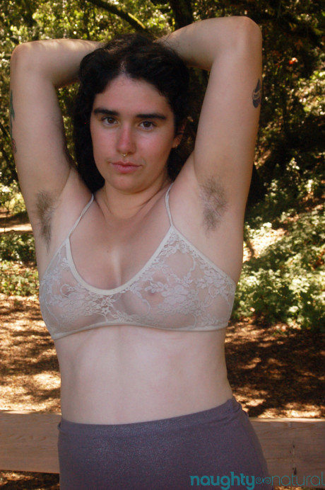 Geeky amateur teen Lucy Haze strips at the park and shows her hairy body