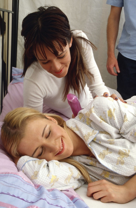 Sweet amateur teens Caroline and Charlie share a stiff boner on a bed