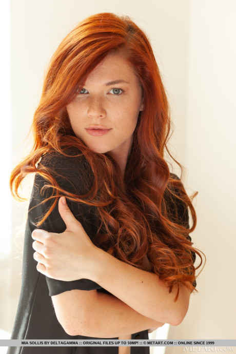 Young young red hair Mia Sollis gets totally naked in a confident fashion