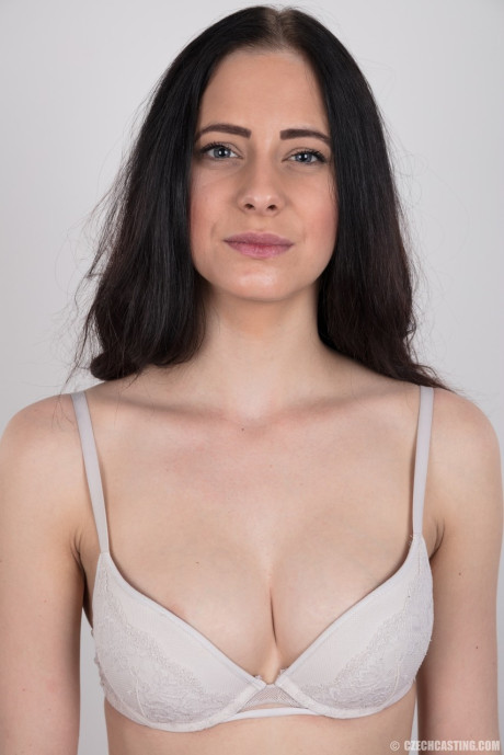 Dark haired female with a firm face model in the undressed for the first time