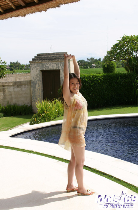 Seductive oriental babe Yui Kurata taking off her dress and panties