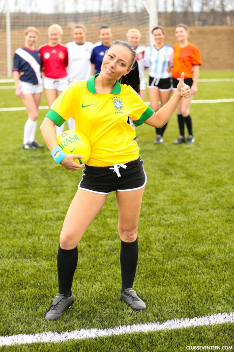 Naughty soccer babes strip each other and flaunt their melons on a soccer pitch