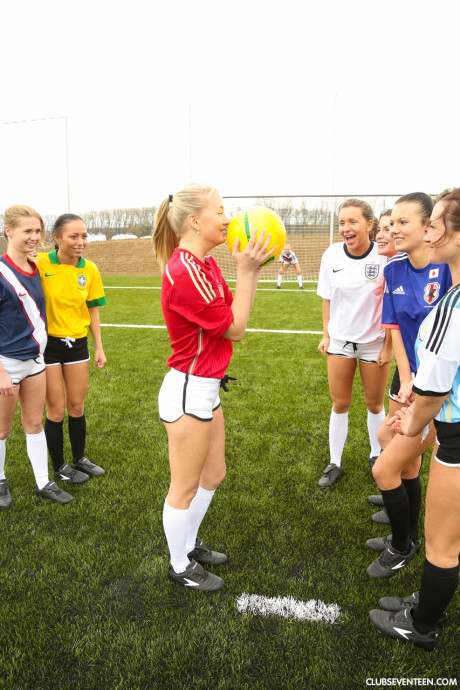 Naughty soccer babes strip each other and flaunt their melons on a soccer pitch