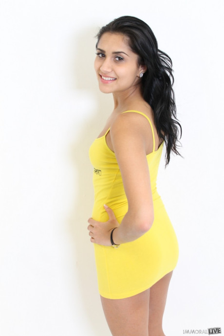 Dark-haired American Giselle Mari doffs her yellow dress & flaunts her tits