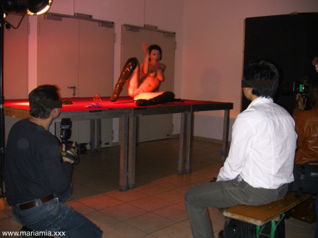 Cute German MILF Maria Mia mounts her cunt with candles at a private show