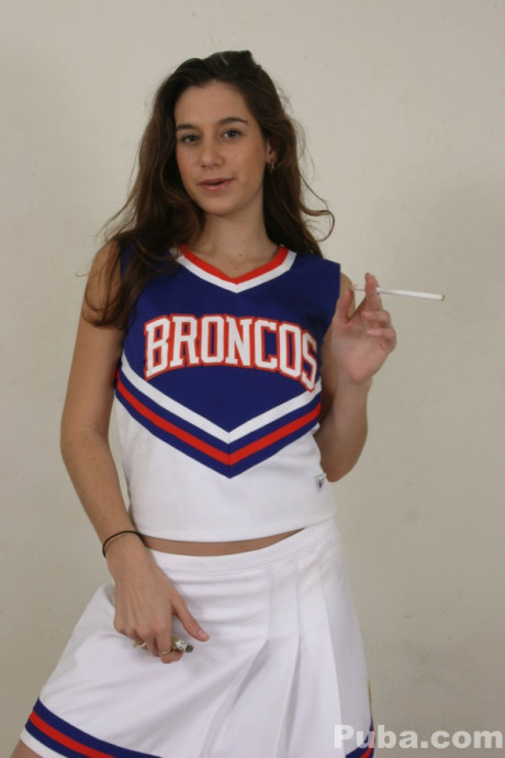 Cheerleader Jackie Ashe smokes while getting naked for POV sex with a enormous dick
