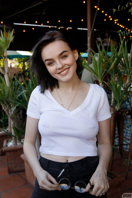 Brunette teenie Vonnie Bean teases with her monstrous juggs in a full tub