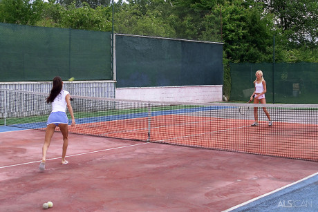 Lesbian sluts have sex on a tennis court after stripping during a match