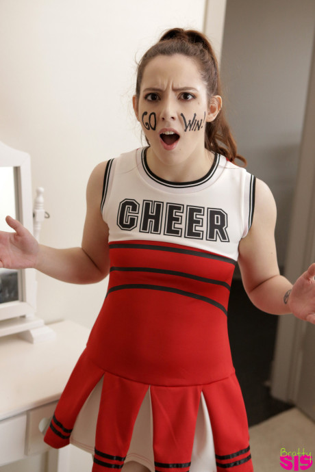 Naughty yellow-haired cheerleader interrupts practice to fuck stepbrother for creampie