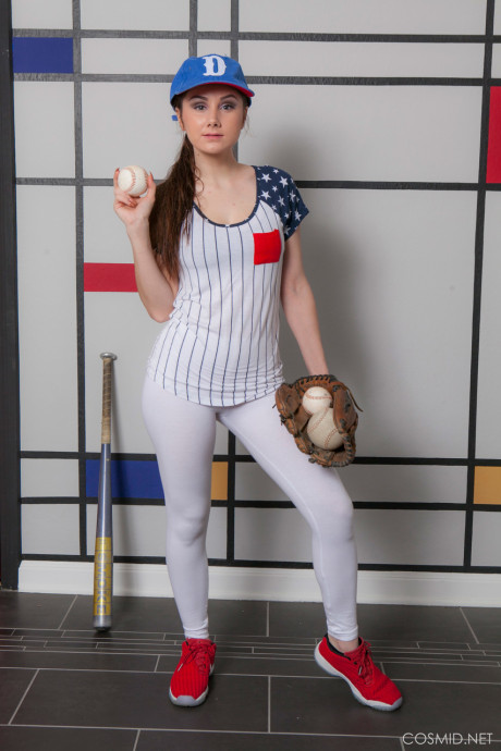 Busty whore girl girl Scarlett Jo takes off her baseball uniform to model undressed in a cap