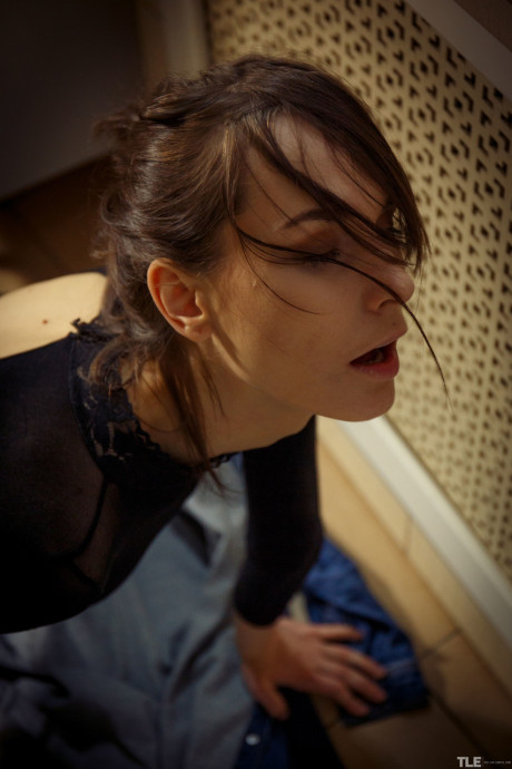 Glamorous brunette Poppy masturbates in her fine bodystocking in the washroom