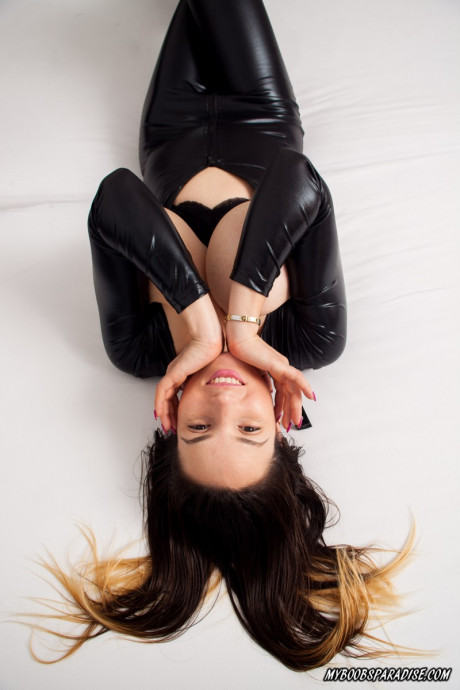 Stunning bitch GF chick Amanda Talia releases her large tits from a catsuit on a bed