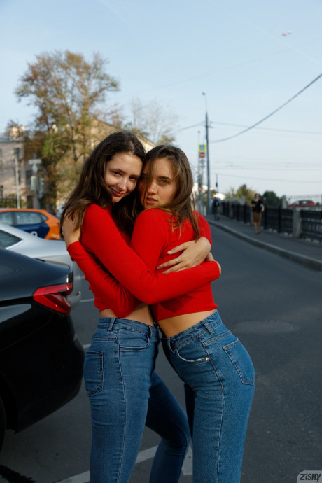 Attractive models in red sweaters Disha & Alevtina Batman show their asses together