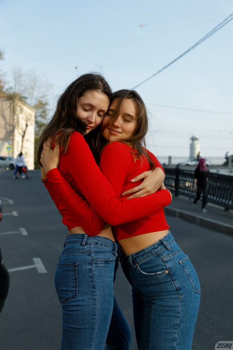 Attractive models in red sweaters Disha & Alevtina Batman show their asses together