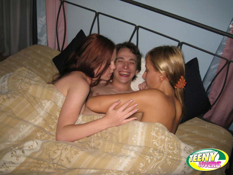 Bisexual teens and their fuck buddy spend that day in bed having a gangbang