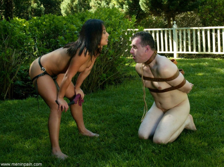 Domina Jasmine Byrne gives metes out anal punishment to her bound sub outdoors