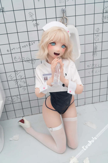 Blonde sex doll masturbates in a bathroom while wearing a black garter belt