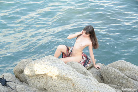 Shameless amateur teenie Sowan flaunts her chinese vagina on a public beach