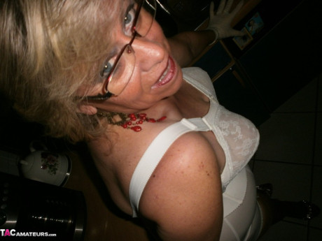 Old yellow-haired Caro exposes her bushy twat while in her galley