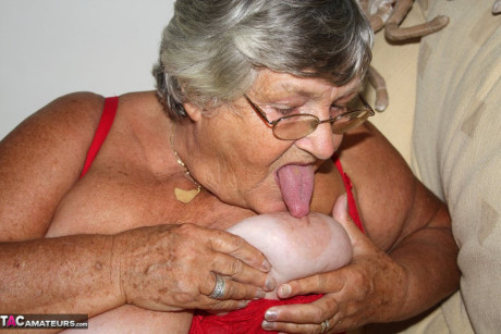Morbidly obese nan granny Libby sucks a nipple before spreading her twat